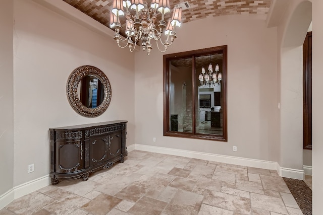 unfurnished dining area with brick ceiling, vaulted ceiling, and a notable chandelier