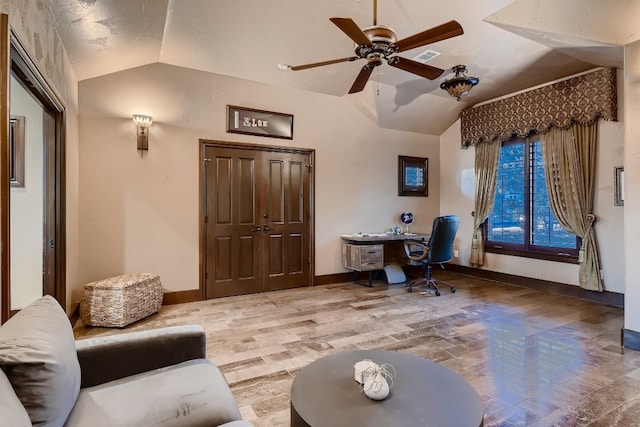 home office with ceiling fan and vaulted ceiling