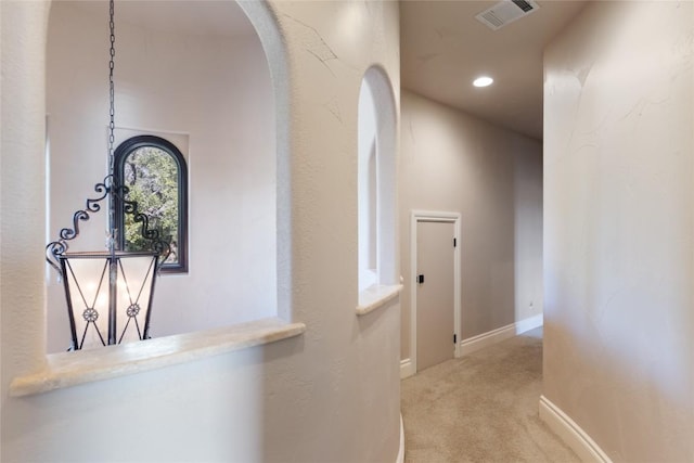 303 Camino Arbolago St, Lakeway, TX 78734 - corridor with arched walkways, carpet, and recessed lighting