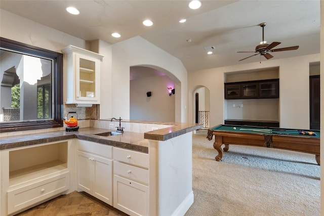303 Camino Arbolago St, Lakeway, TX 78734 - kitchen with arched walkways, recessed lighting, white cabinetry, a ceiling fan, and pool table