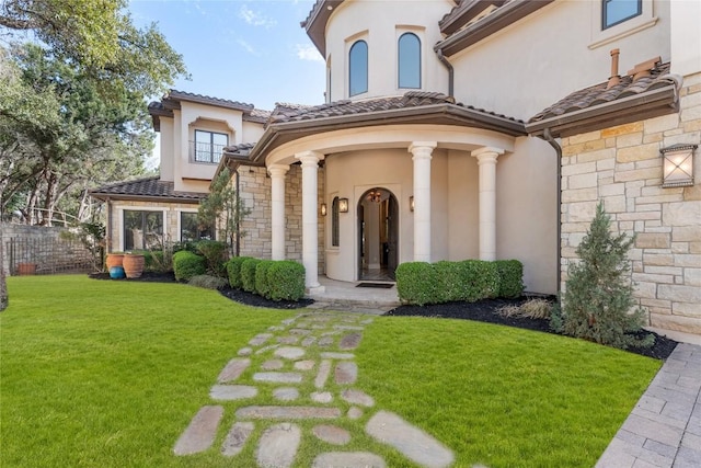 303 Camino Arbolago St, Lakeway, TX 78734 - doorway to property featuring stone siding, stucco siding, and a tile roof