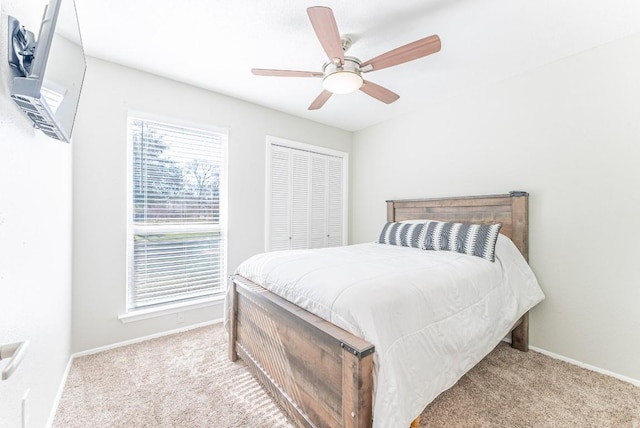 bedroom featuring light colored carpet and ceiling fan