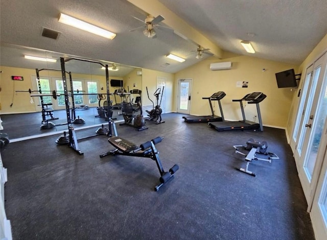 workout area with a wall mounted air conditioner, vaulted ceiling, a textured ceiling, and ceiling fan