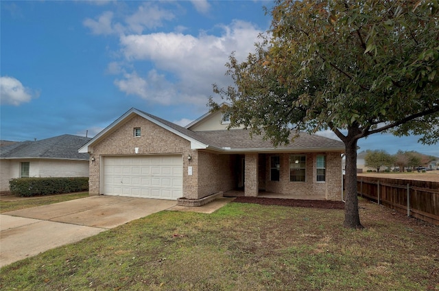 view of front of home with a garage and a front lawn