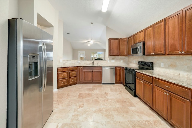 kitchen featuring stainless steel appliances, light stone countertops, sink, and decorative backsplash