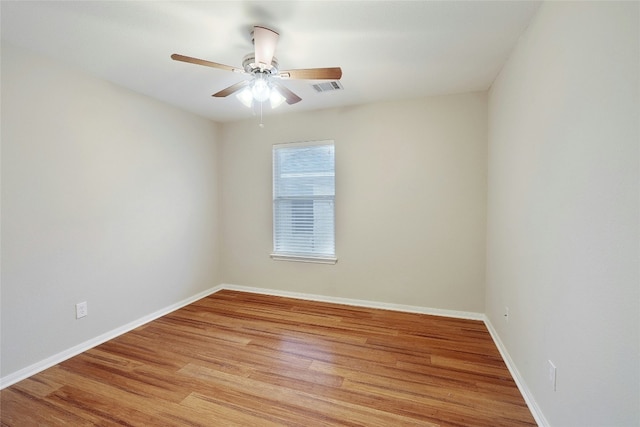 spare room featuring ceiling fan and light hardwood / wood-style floors