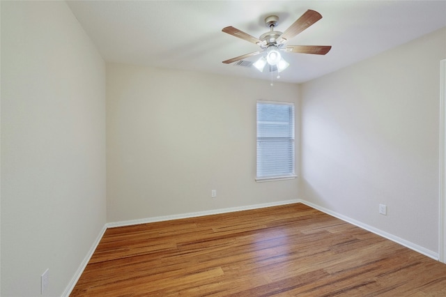 empty room with wood-type flooring and ceiling fan