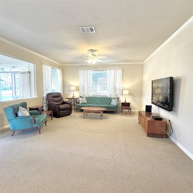 living room featuring crown molding, a healthy amount of sunlight, light carpet, and a textured ceiling