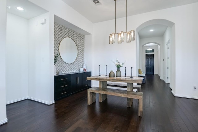 dining space featuring dark hardwood / wood-style flooring