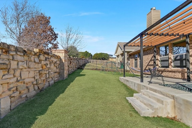 view of yard with a pergola and a patio area