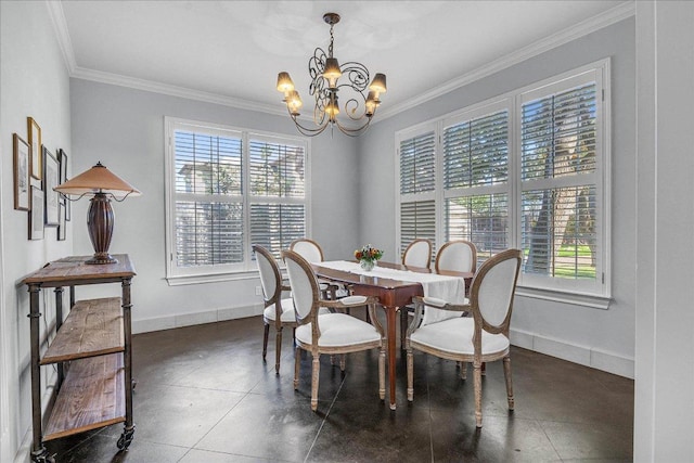 dining area with a chandelier, plenty of natural light, and ornamental molding