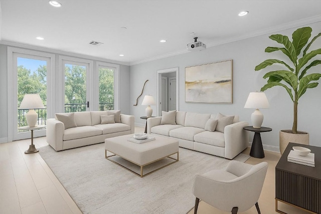 living room featuring recessed lighting, visible vents, and a wealth of natural light