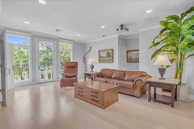 living area featuring crown molding, recessed lighting, and light wood finished floors