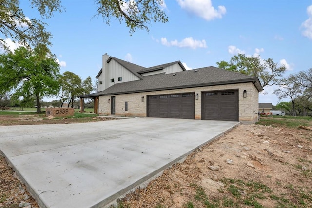 view of property exterior with concrete driveway, roof with shingles, a chimney, and an attached garage