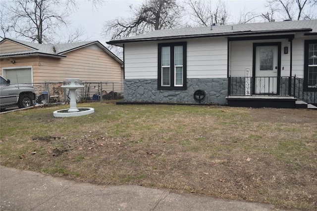 view of side of home featuring a yard