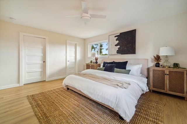 bedroom featuring ceiling fan and wood-type flooring