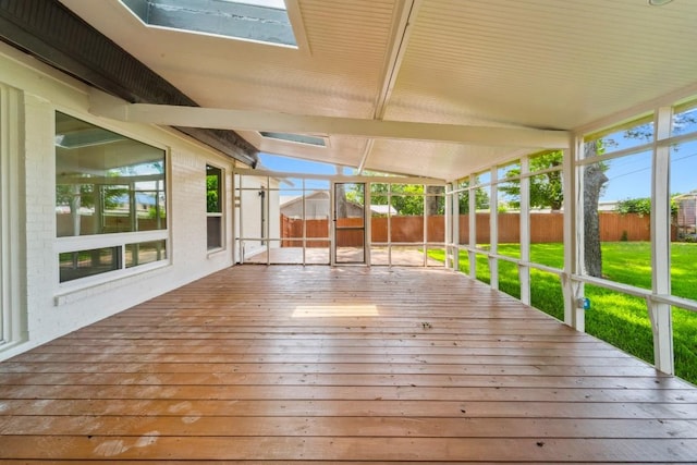 unfurnished sunroom with lofted ceiling