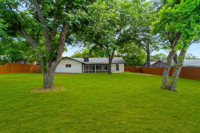 view of yard with a sunroom