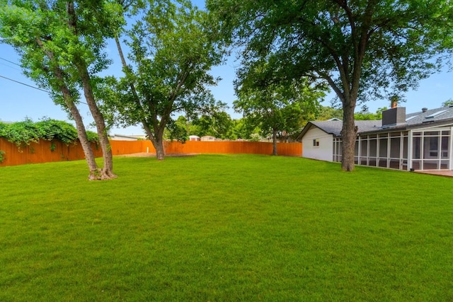 view of yard with a sunroom