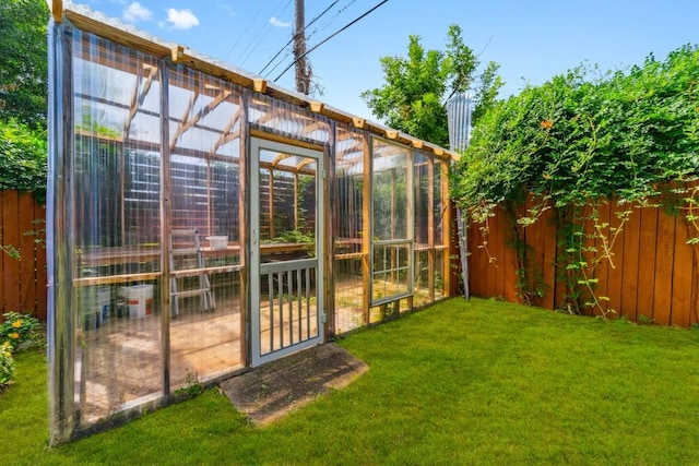 view of outbuilding with a lawn