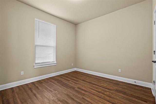 unfurnished room featuring dark hardwood / wood-style flooring