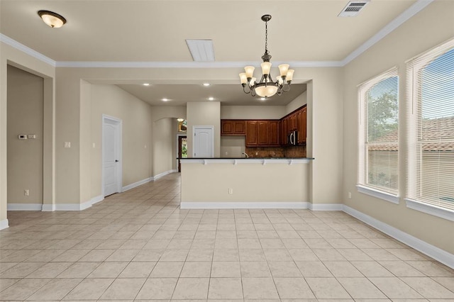 kitchen featuring light tile patterned flooring, a chandelier, hanging light fixtures, ornamental molding, and kitchen peninsula