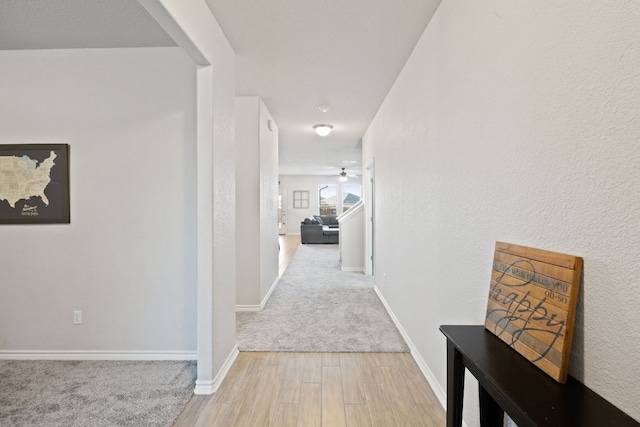 hall with light hardwood / wood-style floors