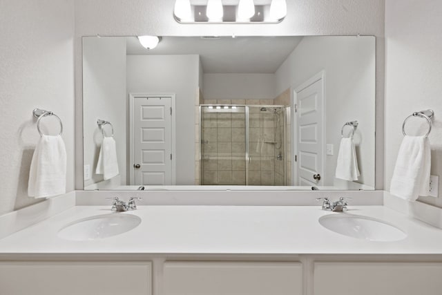 bathroom with vanity and walk in shower