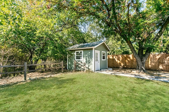 view of outbuilding with a lawn