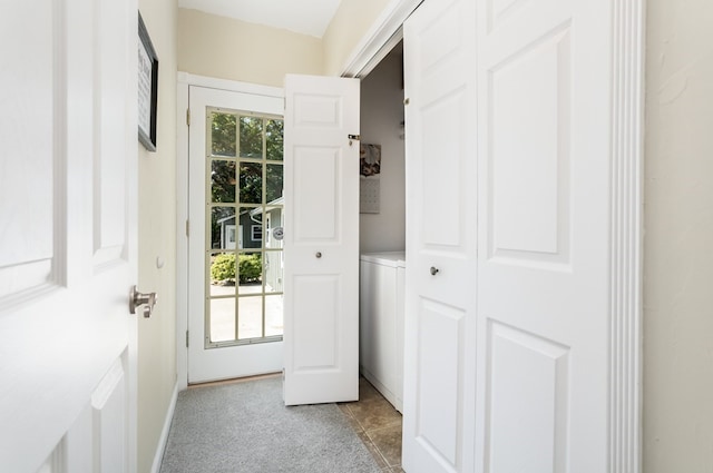 entryway featuring light tile patterned flooring and plenty of natural light