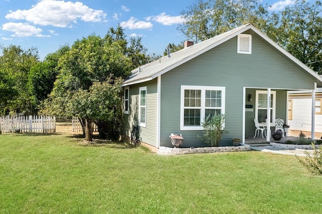 exterior space with a porch and a lawn