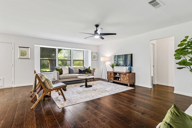 living room with dark hardwood / wood-style floors and ceiling fan