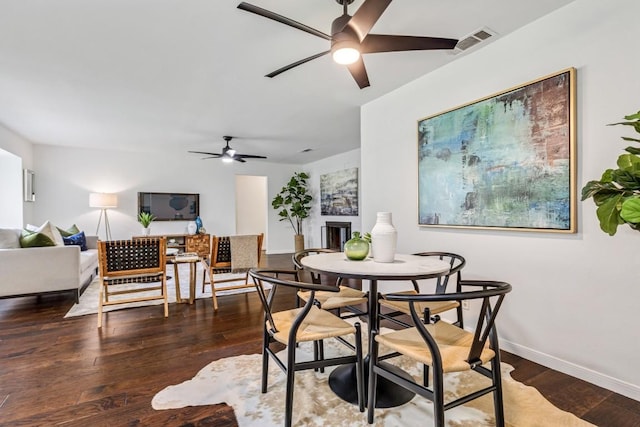 dining space featuring hardwood / wood-style flooring and ceiling fan