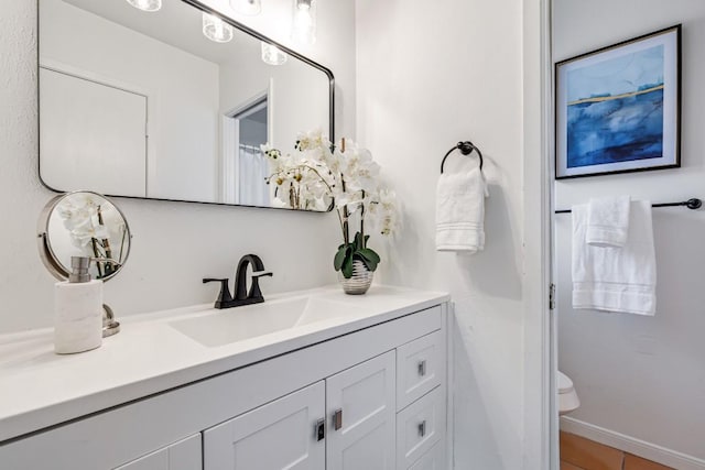 bathroom with vanity and toilet