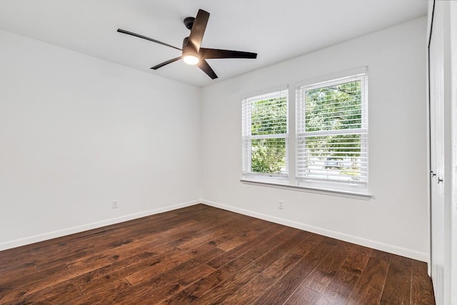 unfurnished room featuring dark hardwood / wood-style floors and ceiling fan