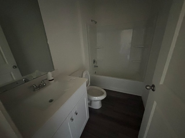 full bathroom featuring vanity, toilet, bathing tub / shower combination, and wood-type flooring