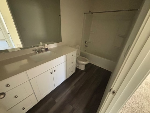 full bathroom with vanity, wood-type flooring, bathing tub / shower combination, and toilet