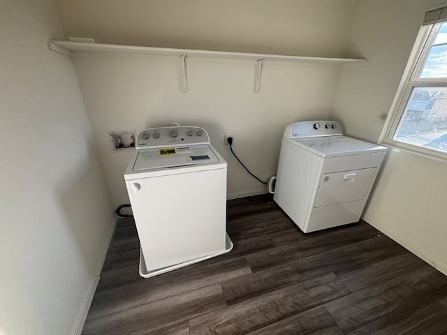 laundry room featuring dark hardwood / wood-style flooring and washer and dryer