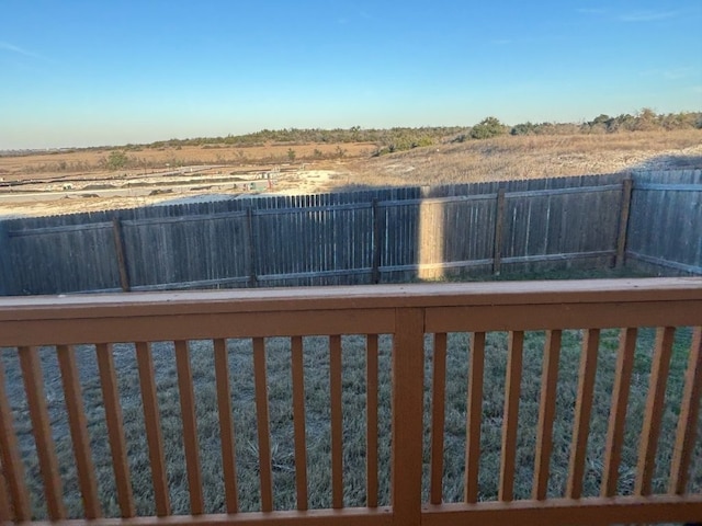 view of yard with a rural view