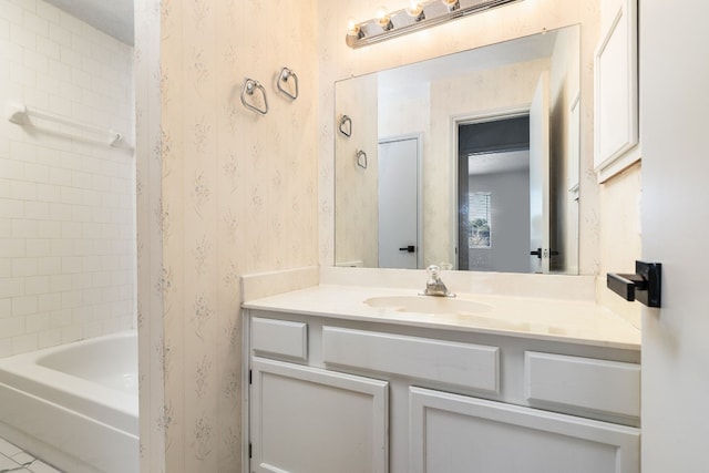 bathroom featuring vanity and tiled shower / bath combo