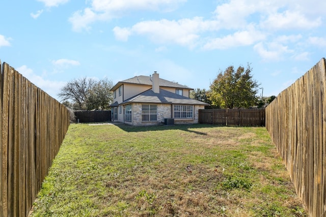 view of yard with central AC