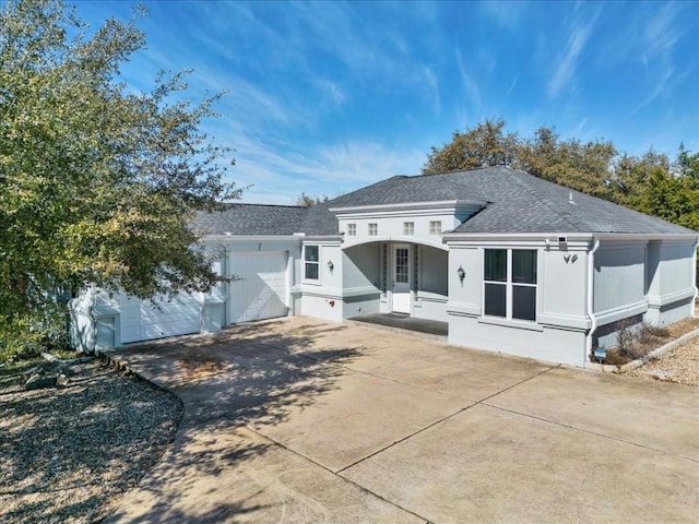 back of house with a garage