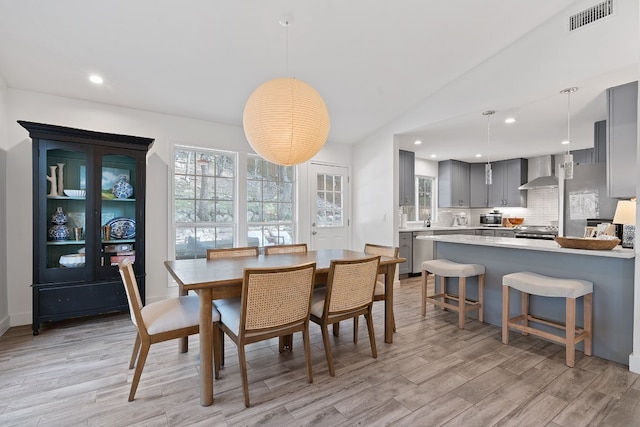 dining space with light hardwood / wood-style floors