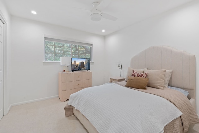 carpeted bedroom featuring ceiling fan