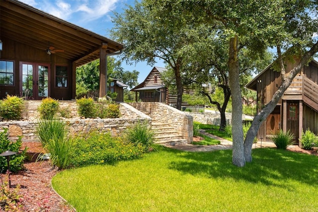 view of yard featuring ceiling fan