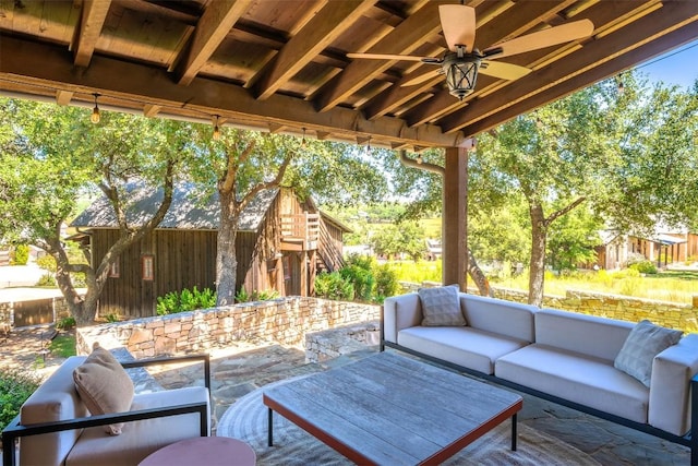 view of patio / terrace with ceiling fan and outdoor lounge area