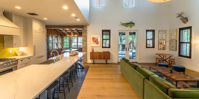 interior space with french doors, recessed lighting, visible vents, and light wood-style floors