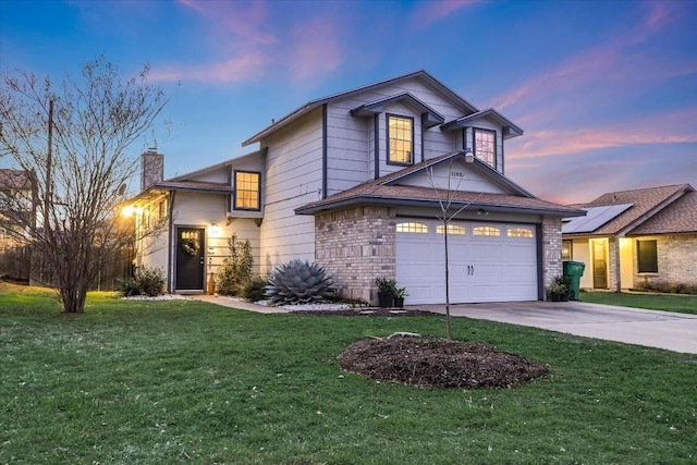 view of front property with a garage and a yard