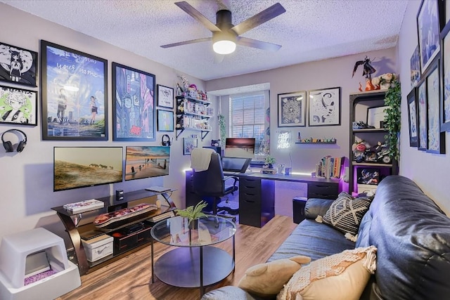 office space with wood-type flooring, ceiling fan, and a textured ceiling