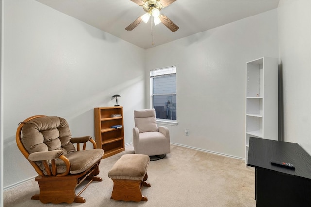 sitting room with light colored carpet and ceiling fan